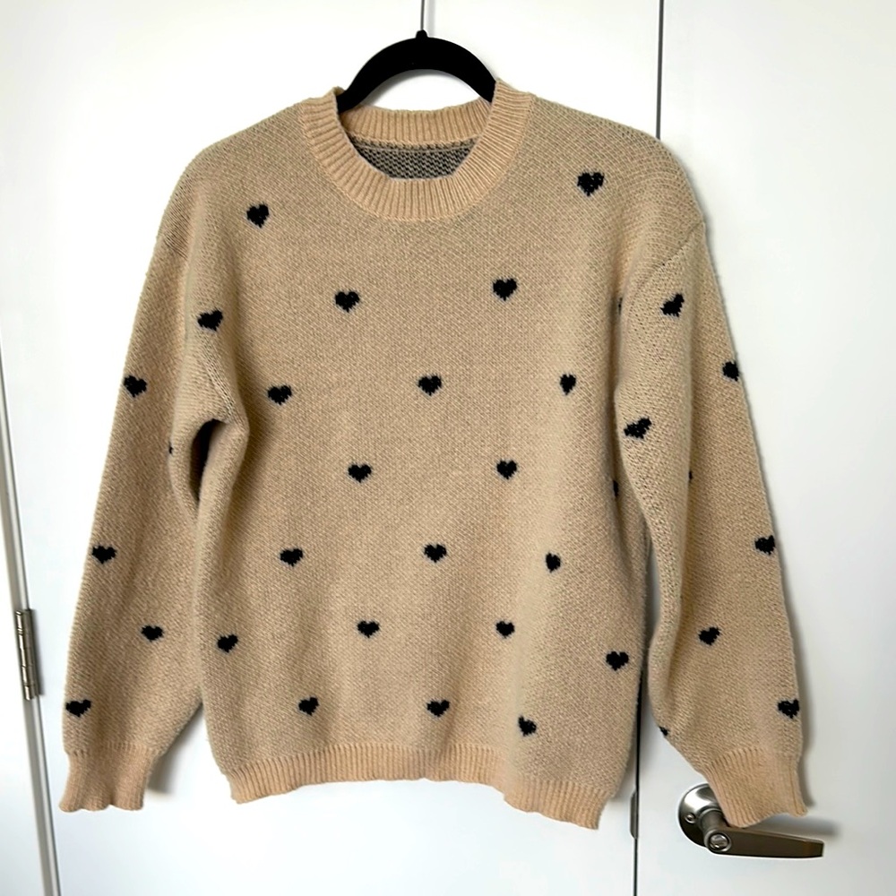 Chic Beige Knit Sweater with Black Heart Accents